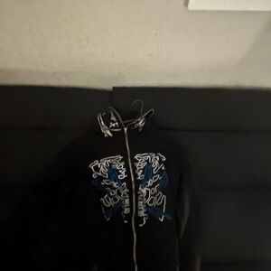 Black Jacket with Blue and White Design